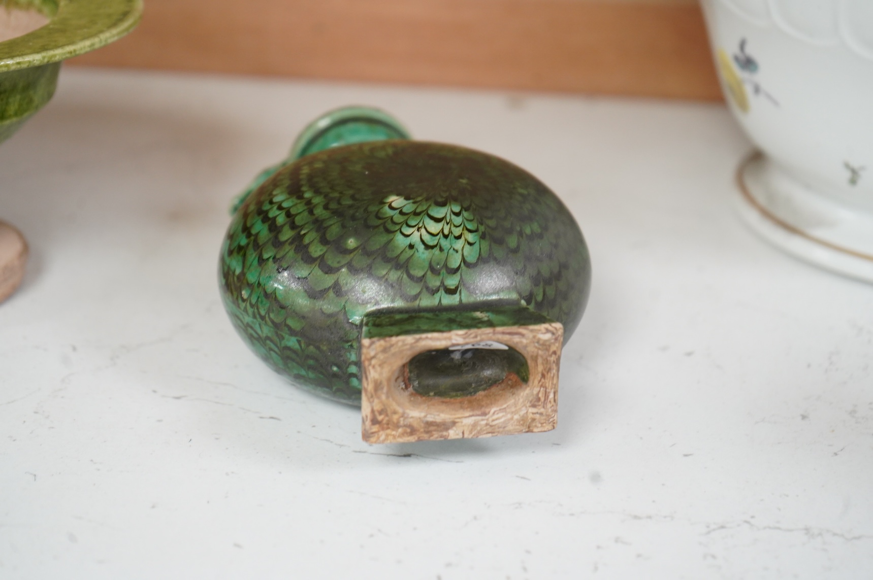 A Chinese agate ware flask, a sancai ewer and a stem dish, largest 26cm high